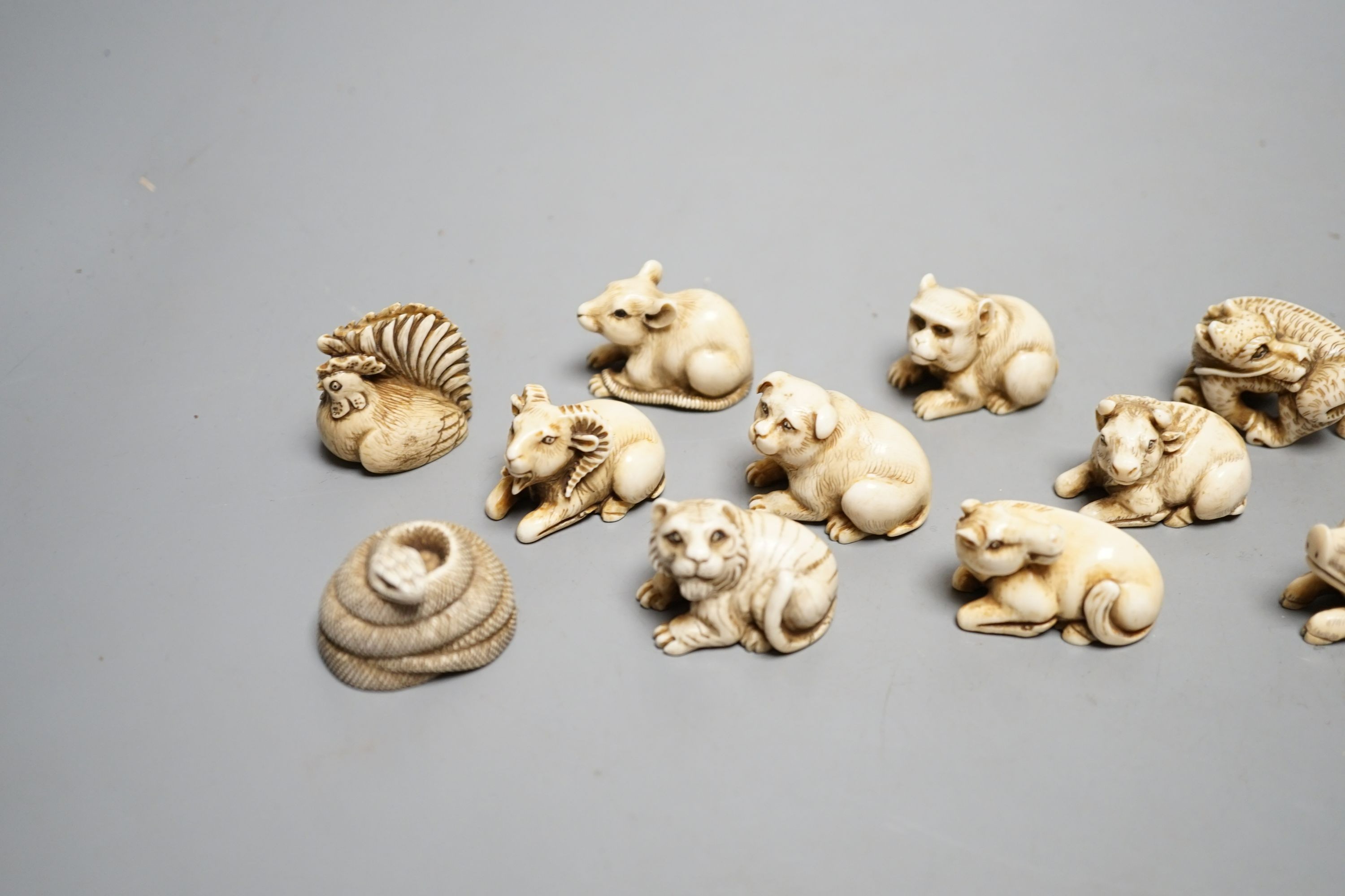 A set of 12 Japanese ivory zodiac animal netsuke, Taisho/early Showa period, signed